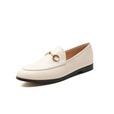 Women with horseshoe buckles and loafers wearing flat bottomed small leather shoes